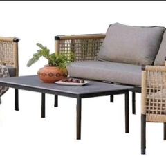 Sofa with black aluminum frame and woven wire